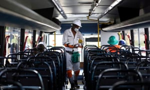 A mine worker wearing a face masks boards a bus ahead of his shift, amid a nationwide coronavirus lockdown, at a mine of Sibanye-Stillwater company in Carletonville, South Africa, 19 May 2020.