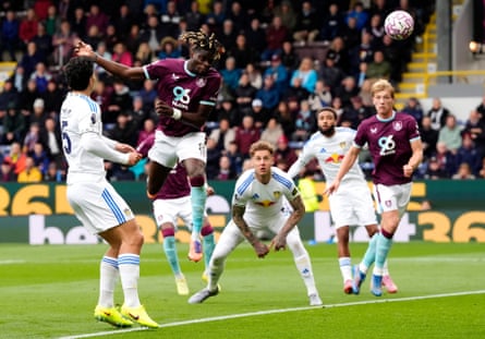Burnley’s Lesley Ugochukwu rises high to score the first goal of the game against Leeds.