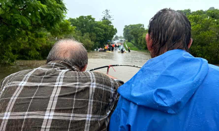 Eddie Lloyd and Adam Guise being rescued in a boat by Sandro.