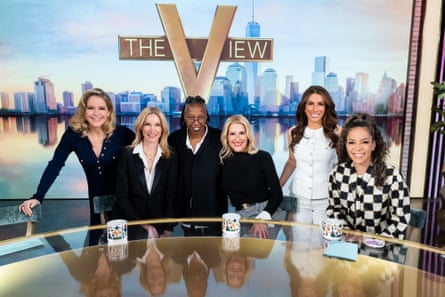 a group of people behind a desk