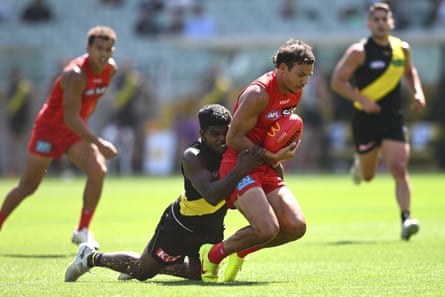 Richmond’s Maurice Rioli tackles his nephew Daniel Rioli