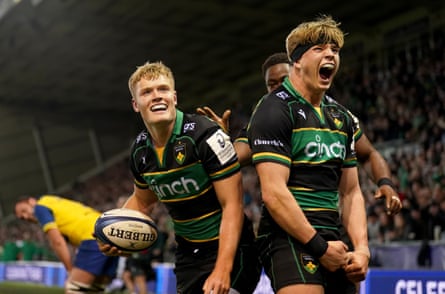 Fin Smith (left) celebrates with Henry Pollock (right) after scoring Northampton’s first try