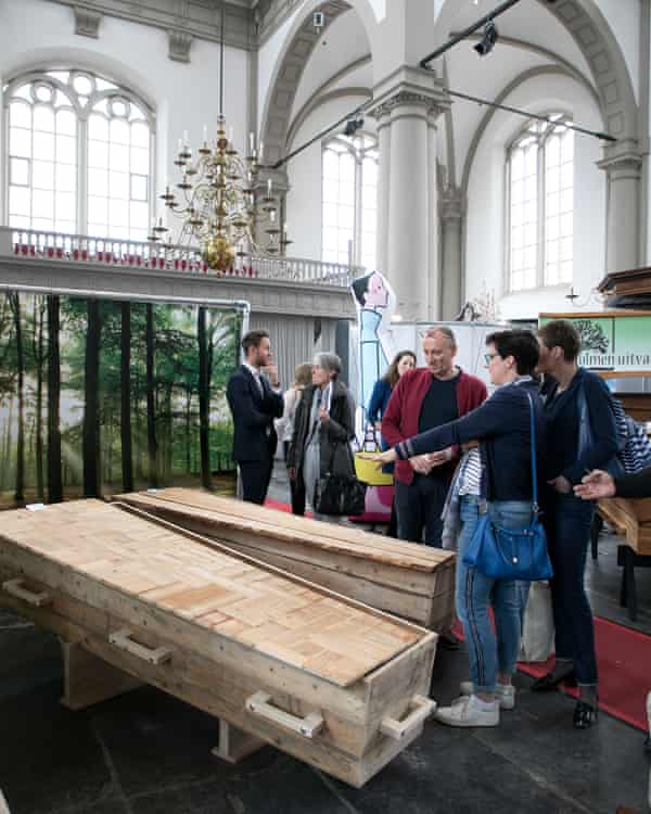 Visitors look at wooden coffins at a funeral expo in Amsterdam last weekend.
