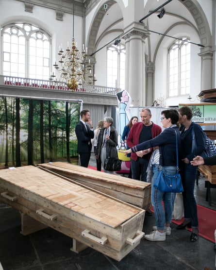 Visitors look at wooden coffins at a funeral expo in Amsterdam last weekend.