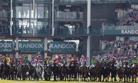 The runners line up for the start of the Grand National last year.