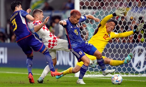 Andrej Kramaric is denied a goal scoring chance as he is crowded out by Japan’s Shogo Taniguchi, Yuto Nagatomo and goalkeeper Shuichi Gonda