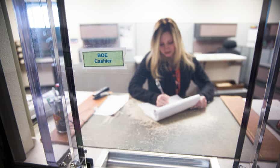 California Board of Equalization tax technician Kelly Loessberg logs payments in Sacramento, California.