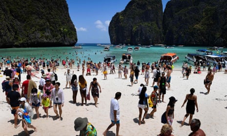 Tourists relax on Thailand’s Maya Bay beach