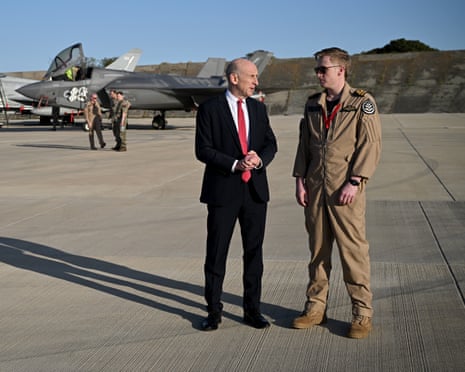UK defence secretary John Healey talks to a pilot at RAF Akrotiri on 5 March after the airbase was targeted by Iranian drones