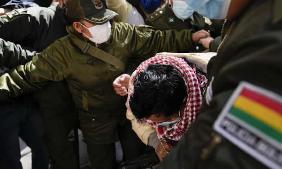 Max Mendoza was escorted in handcuffs by police to San Pedro jail in La Paz.