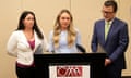 Kylie McKenzie, middle, with her attorney Robert Allard, right, and victim advocate Jancy Thompson, left, speaks to reporters at a news conference in 2022