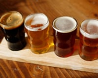 High angle view of beer glasses in tray on wooden tableGettyImages-1143340314