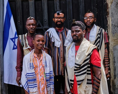 Moshe Ben Avraham, back centre, with fellow synagogue leaders and family members. Photograph: Emeke Obanor/The Guardian