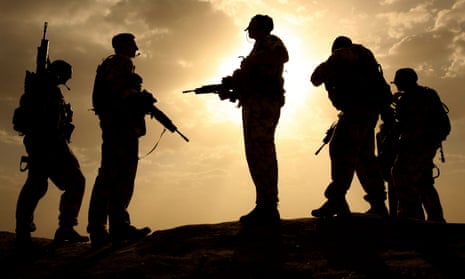 Is Britain guilty of crimes of aggression? … British soldiers are silhouetted against the sky in Helmand.