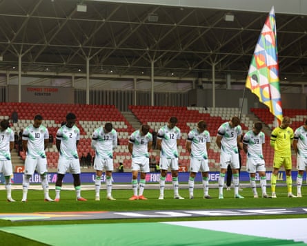 Ireland players bow their heads during the Israeli national anthem.