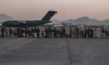 People line up near the plane