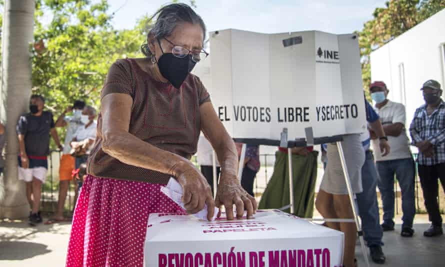 A woman in Tehuantepec, Oaxaca state, casts her vote.