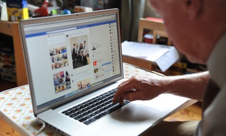 An older person using Facebook on a computer