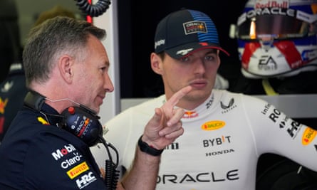 Red Bull team principal Christian Horner speaks with Max Verstappen in the team garage during practice in Bahrain in March 2024