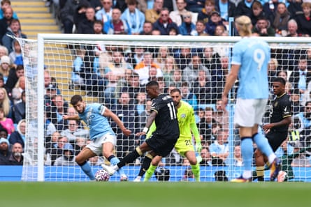 Jaidon Anthony shoots before the ball ricocheted off Rúben Dias to beat Gianluigi Donnarumma for Burnley’s equaliser.