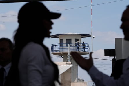 Silhouette of woman outside prison