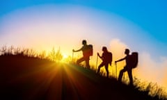 People hiking together at sunrise