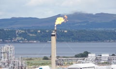 Grangemouth, Scotland, UK. 20th August, 2014. Gas flare at the INEOS plant in Grangemouth .I neos has bought a majority share in a licence for shale gas exploration and development in Scotland. The licence covers 329 square kilometres of the Midland Valley , which consists of the area around Airth and Falkirk , near its Stirlingshire site. Grangemouth is being developed to import shale gas ethane from the US.