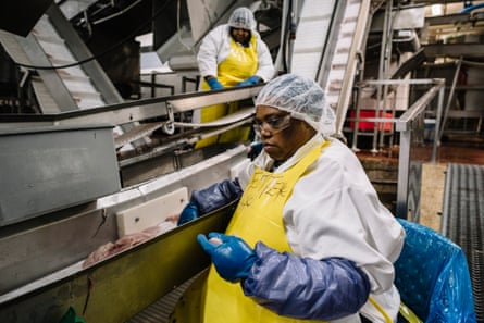 Employees work to process catfish fillets at Consolidated Catfish Producers LLC.