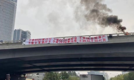Protest banners seen on the Sitong bridge overpass in Beijing.