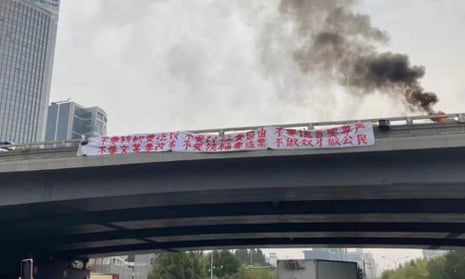 Protest banners seen on the Sitong bridge overpass in Beijing.