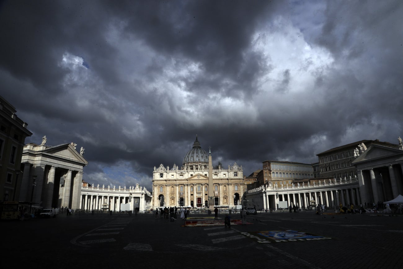 Clouds hang over St Peter’s Basilica at the Vatican