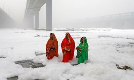 Hindu women had to immerse themselves into the polluted waters of the Yamuna River. 
