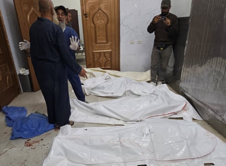 Bodies of Palestinian people in the Nasser hospital who were reportedly killed by Israeli soldiers who opened fire at people gathered near an aid distribution site in southern Gaza.