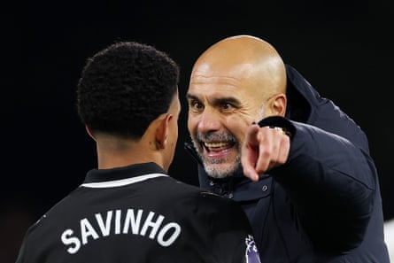 Manchester City manager Pep Guardiola barks orders at Savinho.