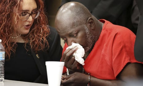 Sidney Holmes, 57, cries after he was exonerated in a Broward county courtroom on Monday.