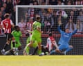 Fulham’s Bernd Leno tips over a close-range shot from Brentford’s Dango Ouattara in their 0-0 draw at the Gtech Community Stadium.