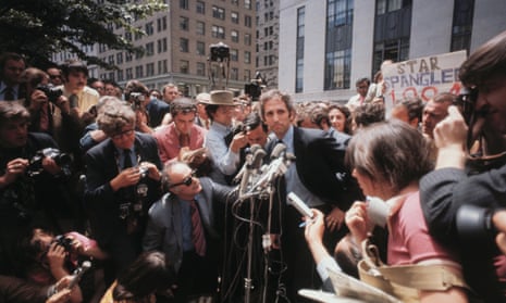 a man surrounded by reporters