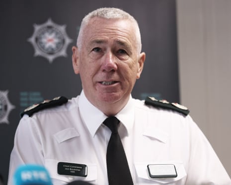 PSNI chief constable Jon Boutcher in white uniform shirt speaks at a press conference.