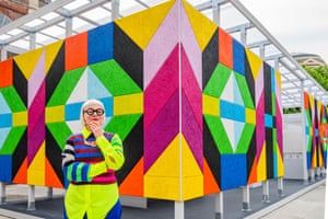 London, UK. The London-born artist and designer Morag Myerscough poses in front of the exterior wall of a freestanding installation during Clerkenwell Design Week