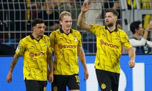 FBL-EUR-C1-DORTMUND-PSG<br>Dortmund's German forward #14 Niclas Fuellkrug (R) celebrates with Dortmund's English midfielder #10 Jadon Sancho (L) and Dortmund's German midfielder #19 Julian Brandt scoring the opening goal during the UEFA Champions League semi-final first leg football match between Borussia Dortmund and Paris Saint-Germain (PSG) on May 1, 2024 in Dortmund. (Photo by Odd ANDERSEN / AFP) (Photo by ODD ANDERSEN/AFP via Getty Images)