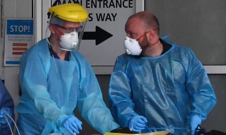 Staff wear personal protective equipment (PPE) as they work at the Royal Liverpool Hospital in Liverpool