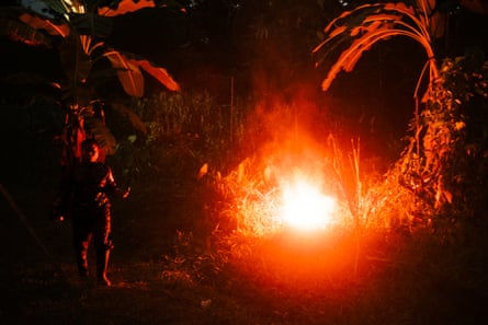 A night shot of a campfire burning