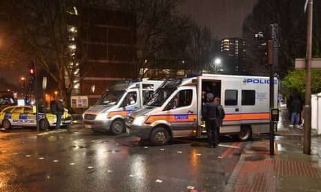 Police at the scene of a fatal stabbing in Battersea, south London, 5 February.