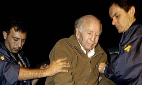 Paul Schaefer, centre, picture in 2005 after his arrest in Argentina, founded Colonia Dignidad where political prisoners were tortured by the state security service.