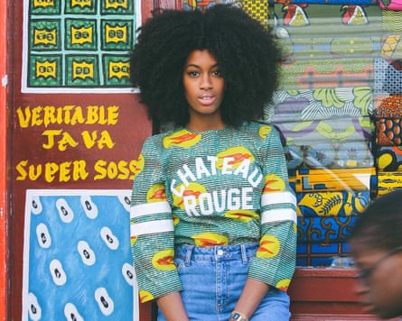 A woman in a sweatshirt with the name of Maison Château Rouge on the front