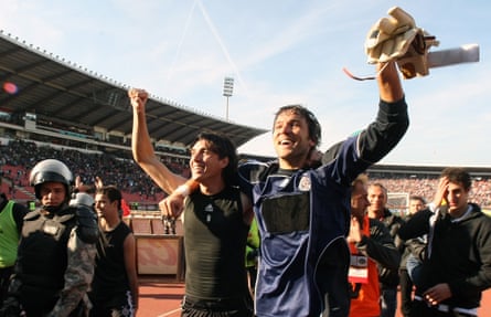 Stojkovic celebrates with his Partizan team-mate Cleo after beating Red Star in Belgrade on 23 October 2010.
