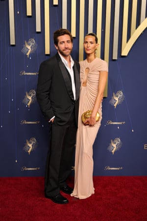 Jake Gyllenhaal wore his Prada suit, waistcoat and shirt all undone, while his partner Jeanne Cadieu wore a beige Schiaparelli gown with a gold-lip clutch