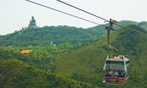 The Ngong Ping Cable Car, Big Buddha statue in the distance.