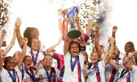 Lyon captain Wendie Renard lifts the Women's Champions League trophy after their 3-1 win over Barcelona in Turin.