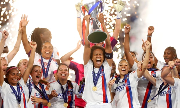 Wendie Renard lifts the trophy for Lyon.